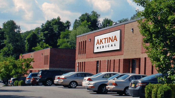 Front of Aktina Medical building with cards