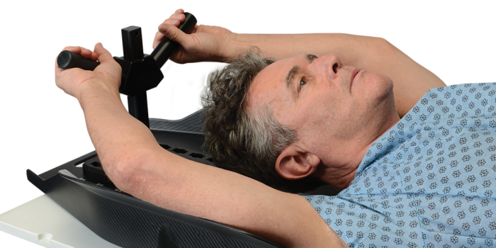 Patient lying down using Arm Cradle 4 with Y handle hand position