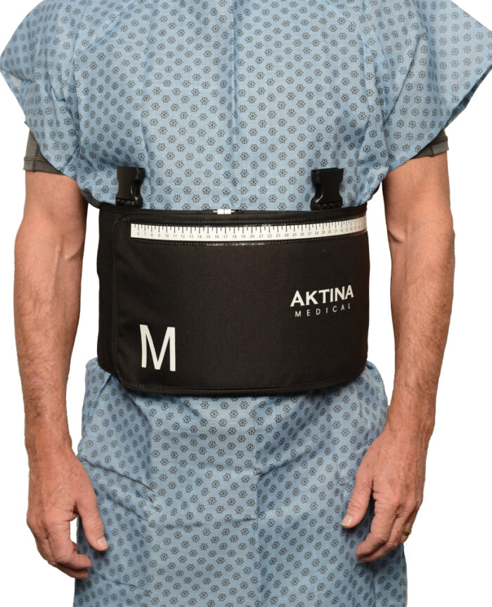 Man standing with arms on side wearing an Aktina medium sized compression belt